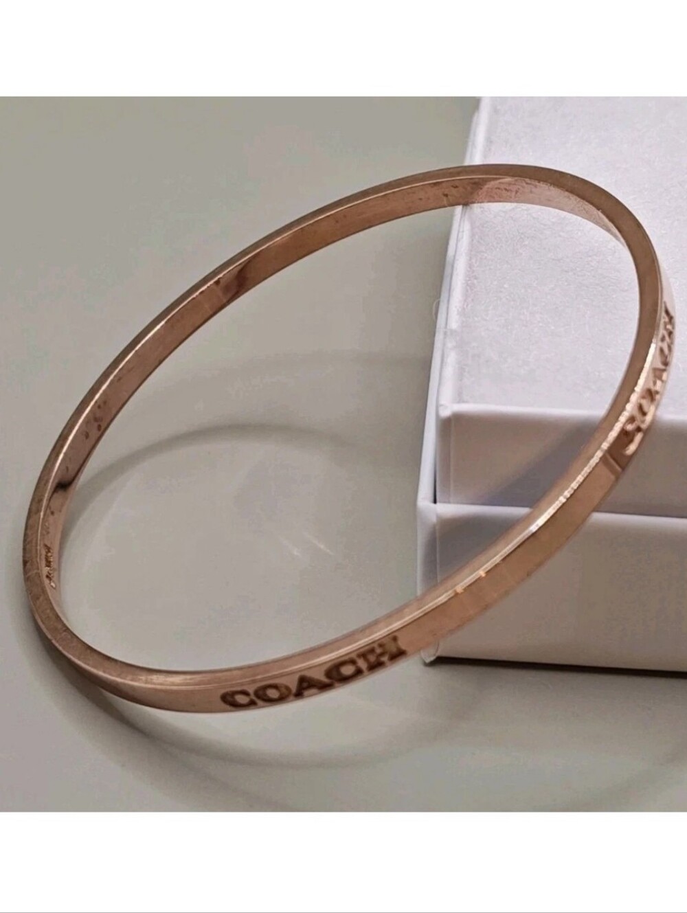 Coach Bangle Bracelet Rose Gold Plated Engraved Logo Elegant Holiday Size 7.75